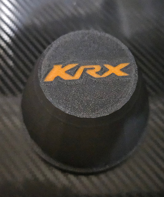 Set of 4 black center caps with orange KRX logo for oem KRX1000 wheels